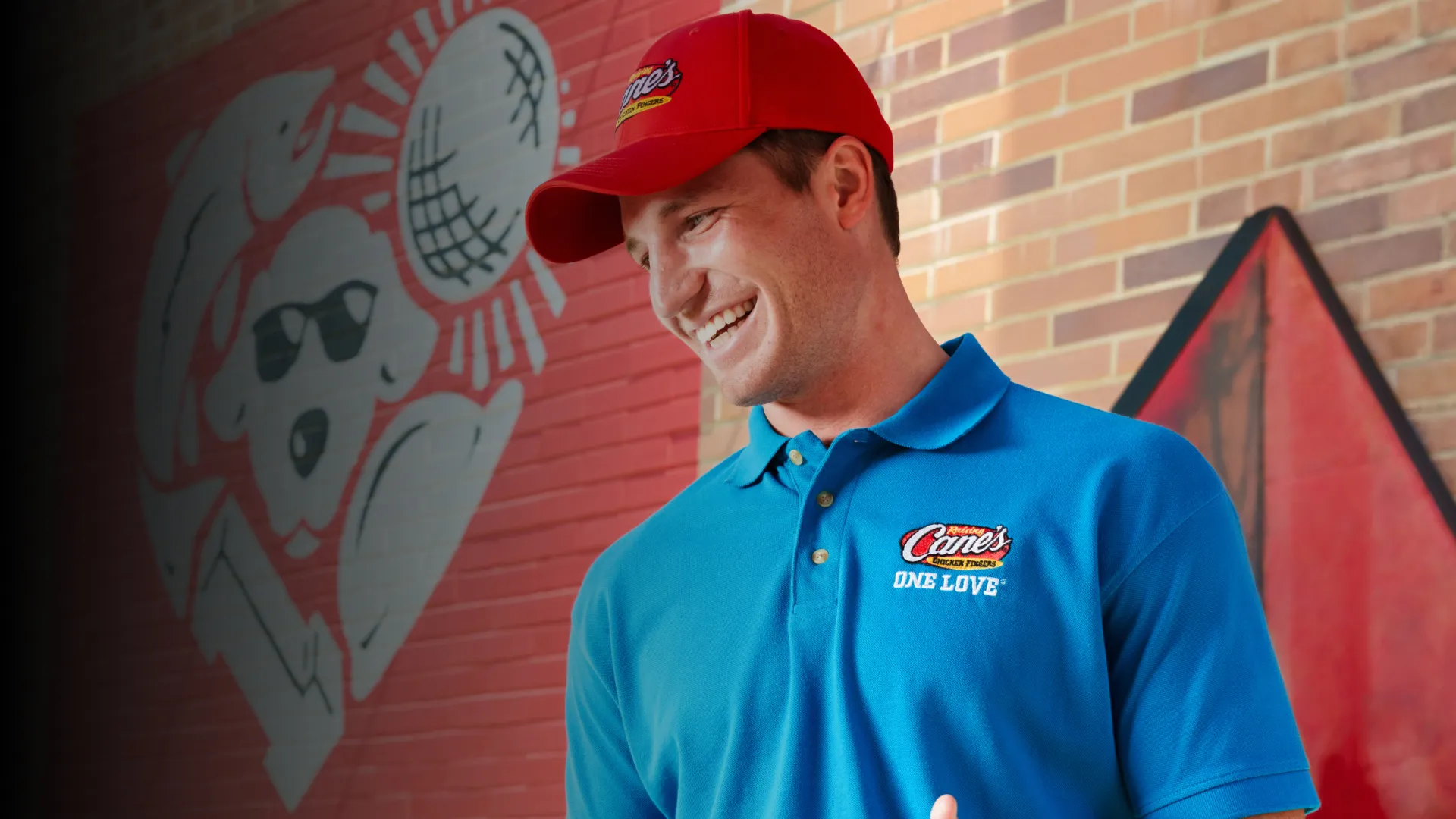 A male employee laughing
