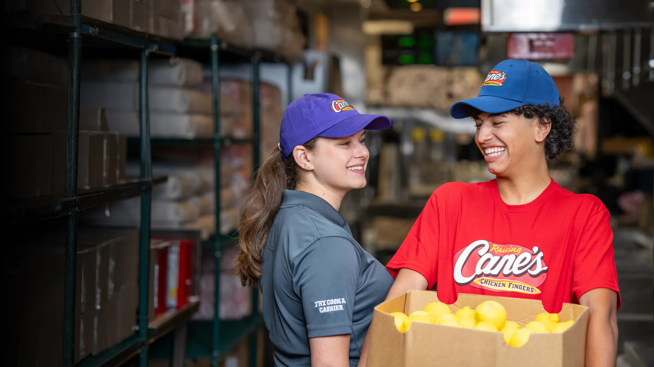 2 employees holding packages