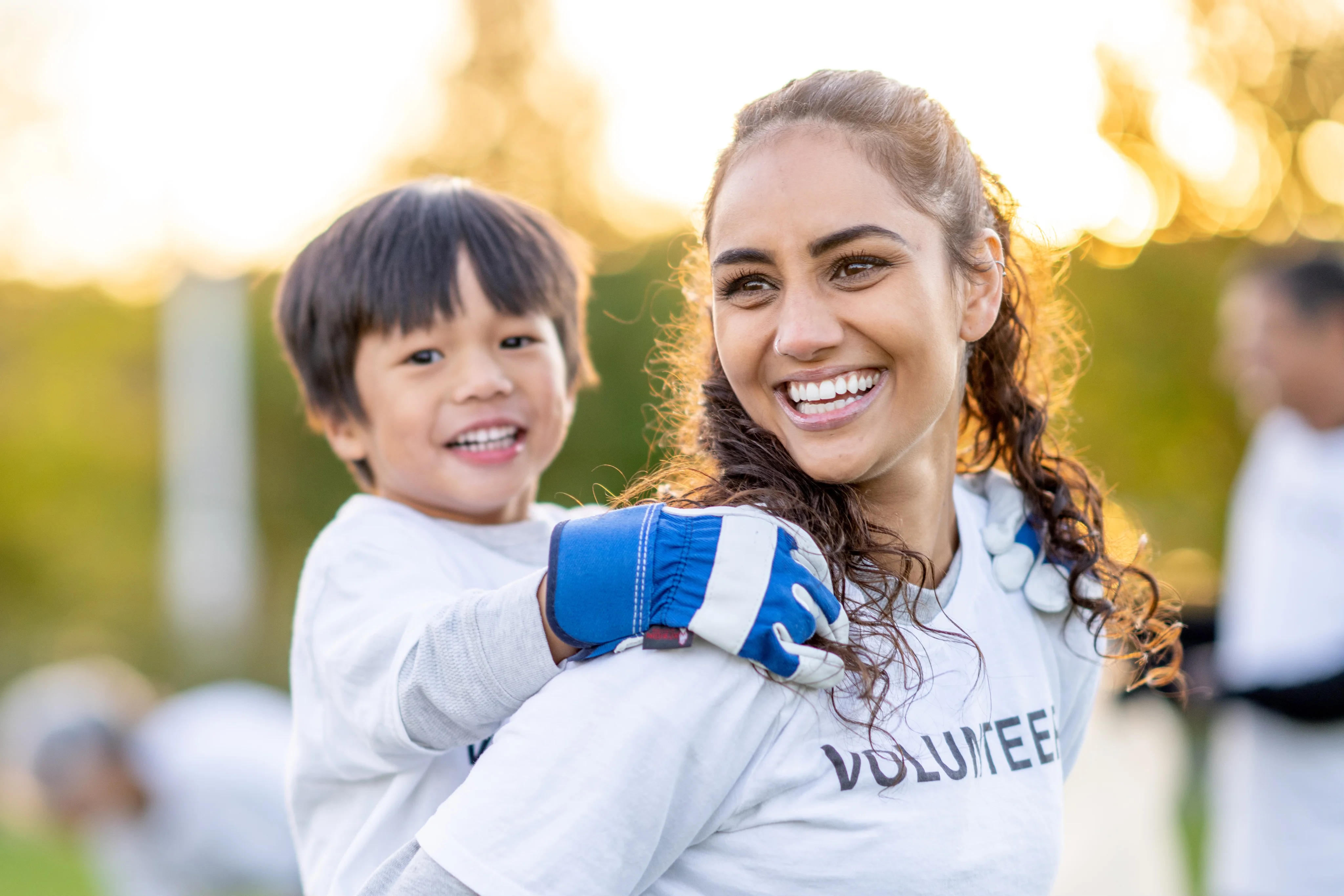 Healthcare professional with young patient outdoors