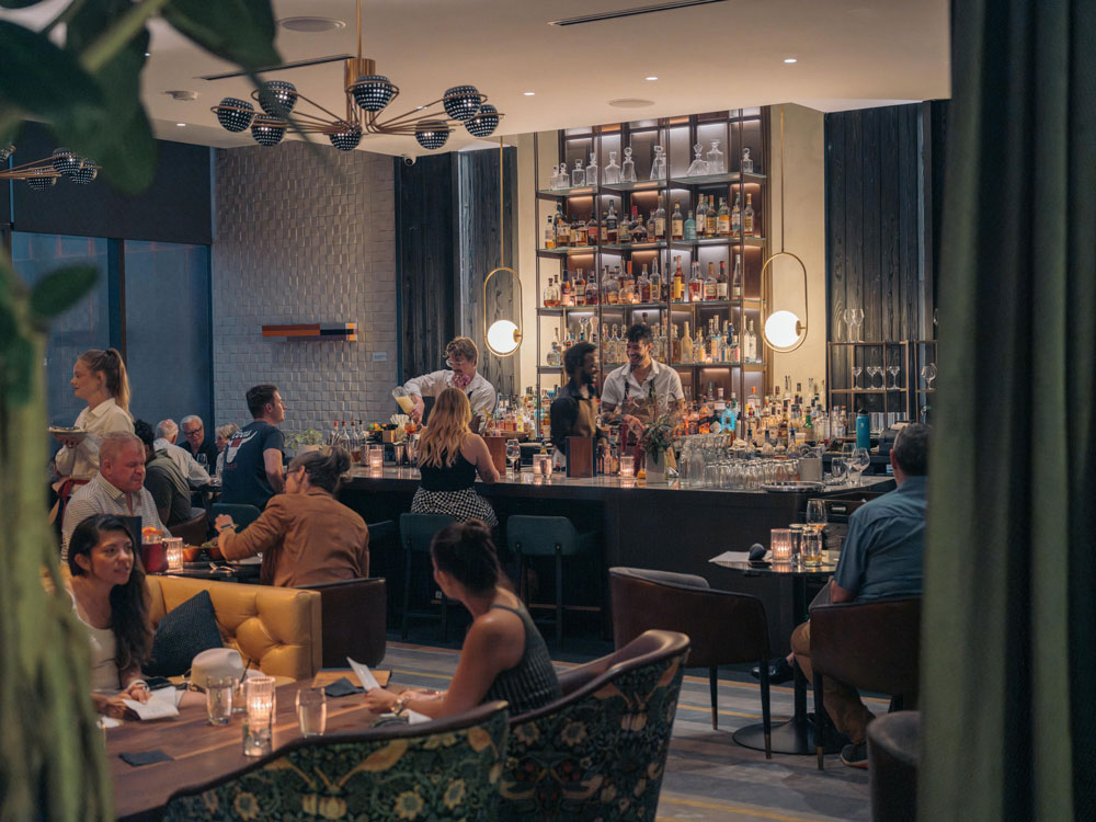 Guests seated at a hotel bar
