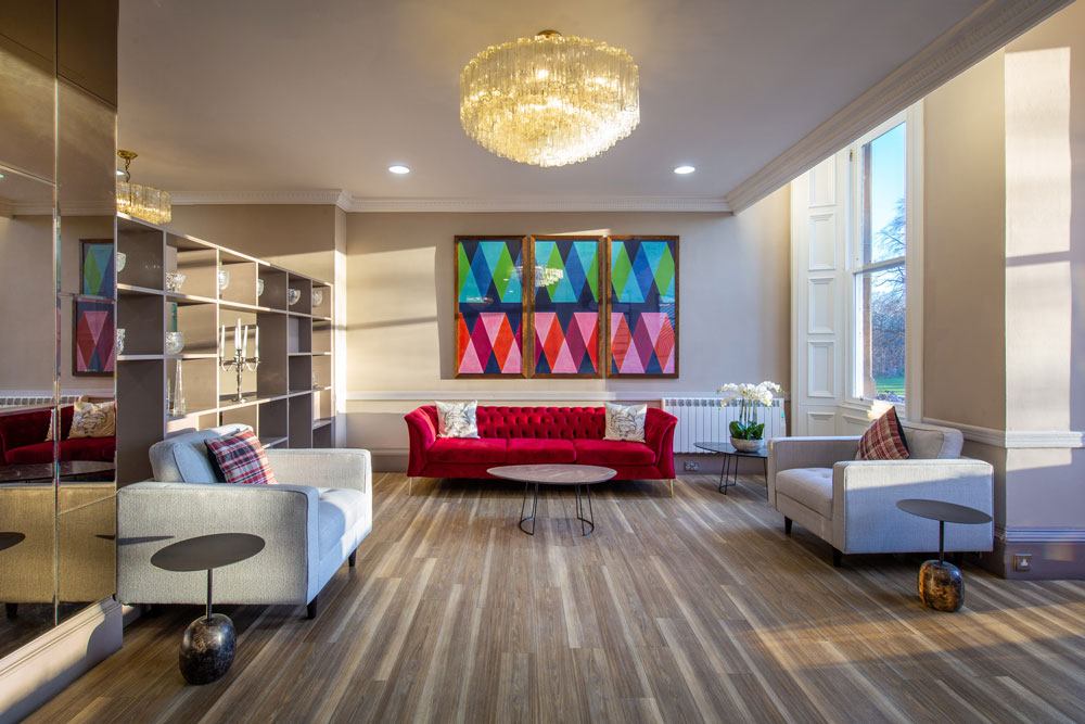 Colorful hotel lobby with red sofa